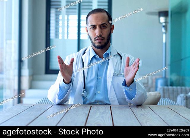 Portrait of caucasian male doctor looking at the camera