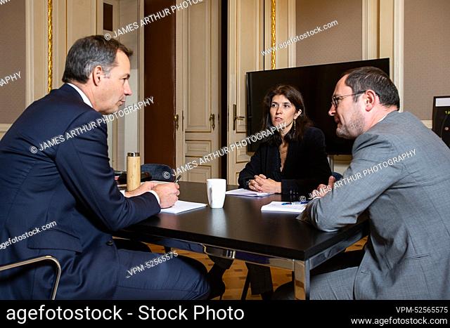 Prime Minister Alexander De Croo, new State Secretary for Budget Alexia Bertrand and Justice Minister Vincent Van Quickenborne pictured during a meeting between...