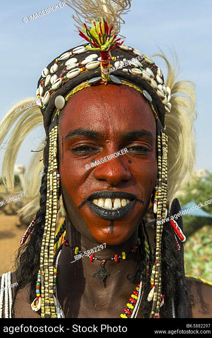 Wodaabe-Bororo man with face painted at the annual Gerewol festival, courtship ritual competition among the Fulani ethnic group, Niger, Africa