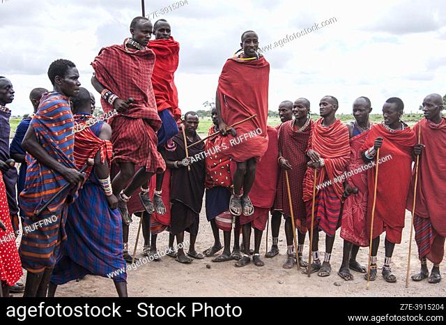 Masai men in traditional dress demonstrating their jumping skills. Masai Village, Amboseli National Park