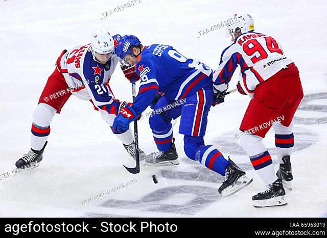 RUSSIA, ST PETERSBURG - DECEMBER 21, 2023: SKA's Sergei Sapego (C), CSKA's Colby Williams (L) and Vladislav Kamenev fight for the puck in a 2023/24 KHL Regular...