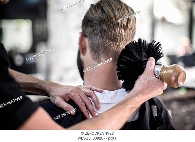 Barber brushing of customer