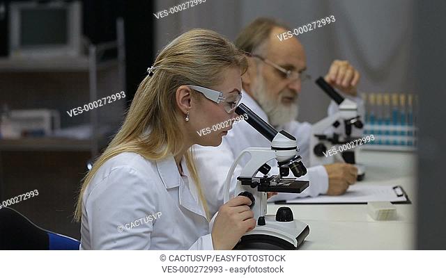 Health care researchers working in laboratory