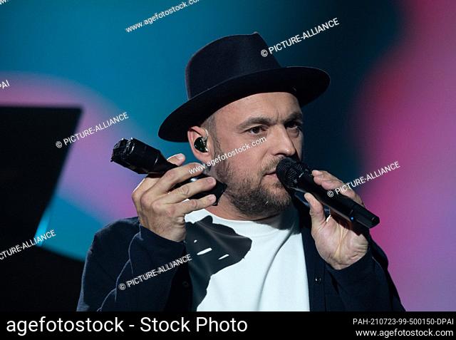 23 July 2021, Saxony-Anhalt, Halle (Saale): German singer Max Mutzke is on stage at the ARD benefit gala. The motto of the benefit evening for the flood...