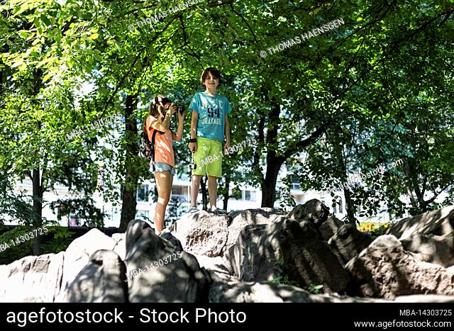 5th Av & W 58TH Street, New York City, NY, USA, Young Boy and Girl at Central Park 14 years old caucasian teenager girl and 12 years old caucasian teenager boy...