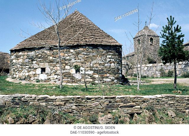 A traditional stone building (palloza) and St Mary's Church 9th century, El Cebrero, on the Way of St James of Compostela (UNESCO World Heritage List, 1993)