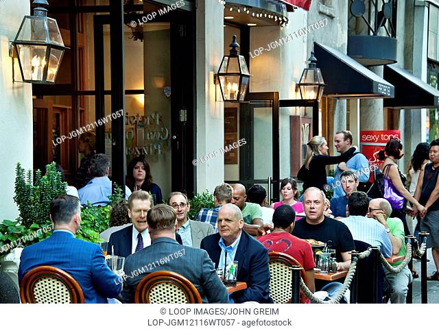 Diners enjoy sidewalk seating at a Philadelphia restaurant
