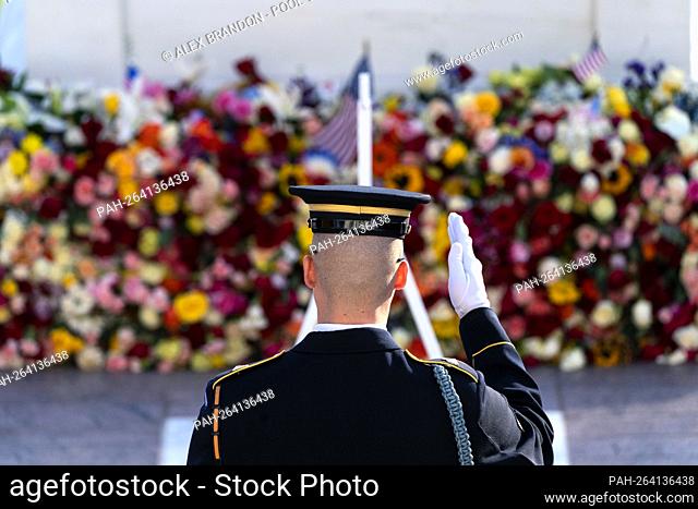 A tomb guard of the 3rd U.S. Infantry Regiment, known as ""The Old Guard, "" salutes before a centennial ceremony for the Tomb of the Unknown Soldier