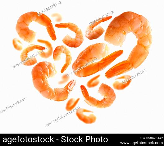 Boiled prawns in the shape of a heart on a white background