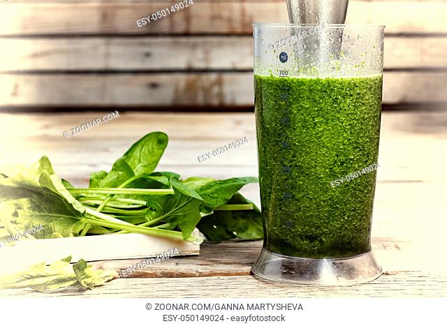 Proper nutrition. DETOX drink made from green vegetables in a blender. COOKING PROCESS. Detox drink made from spinach, cucumber, lime and avocado