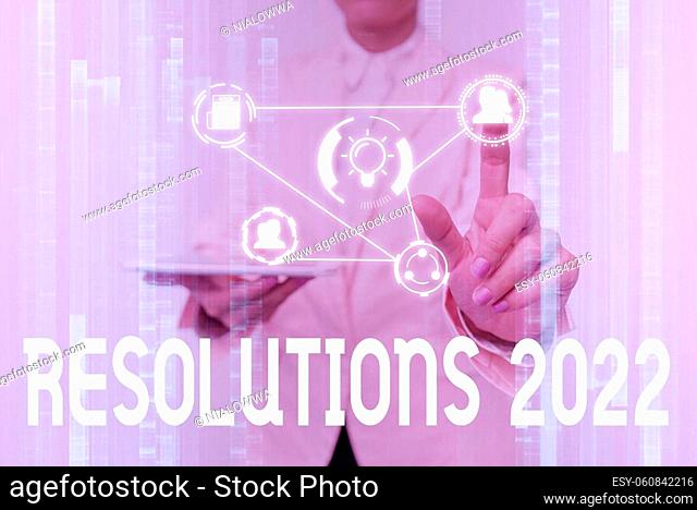 Conceptual caption Resolutions 2022, Word Written on list of things wishes to be fully done in next year Lady In Uniform Touching And Using Futuristic...