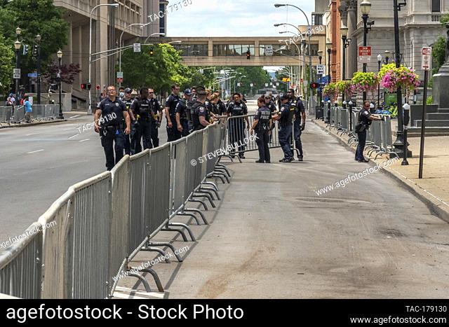 Police arranging barricades at the area of Friday night’s rioting on May 30, 2020 in Louisville, Kentucky. (Credit: Steven Bullock/The Photo Access)
