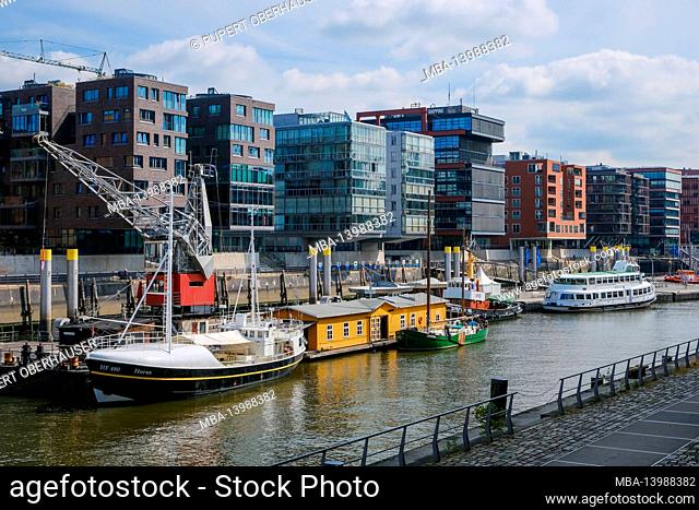 Hamburg, Germany - Hafencity, modern residential buildings and office buildings in the Sandtorhafen, in the traditional ship port with old port crane