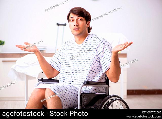 Young handsome man in wheelchair at the hospital
