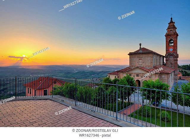 Church and hills of Langhe at sunset