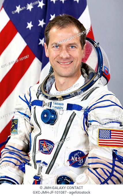 NASA astronaut Tom Marshburn, Expedition 32 backup crew member, attired in a Russian Sokol launch and entry suit, takes a break from training in Star City