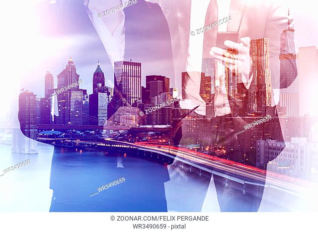 double exposure image of a business man and woman using mobile devices during sunset overlay with cityscape image. modern life and business concept