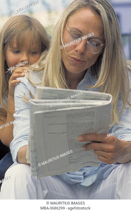 Mother, newspaper, daughter