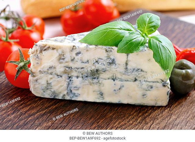 Mediterranean cuisine breakfast: blue cheese, baguette, tomatoes