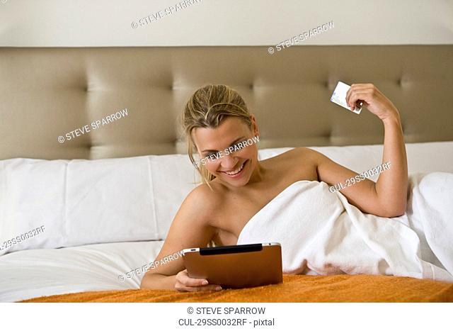 Woman using tablet computer for shopping