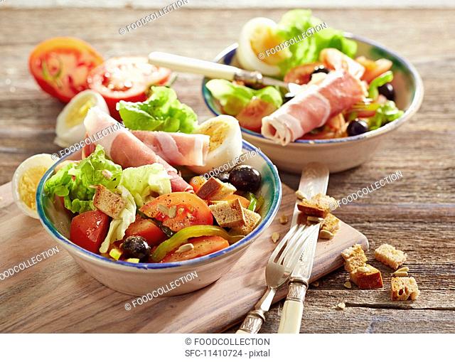 Aragon salad (Oak Leaf lettuce with tomatoes, peppers, egg, olives and Serrano ham)