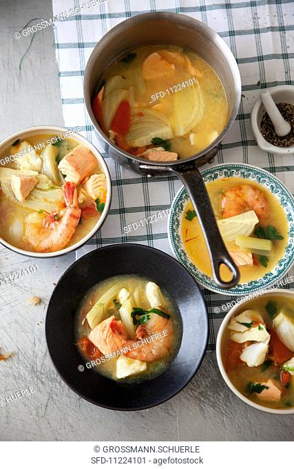 French fish soup with prawns, wild salmon and cod