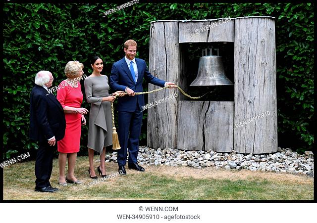 The Duke and Duchess of Sussex in Ireland-Day Two. Prince Harry, The Duke of Sussex, accompanied by his wife The Duchess of Sussex ring the peace Bell while...