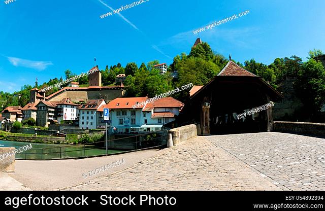Fribourg, FR / Switzerland - 30 May 2019: view of the historic Place de Jean-Francois-Reyff Square and Bernbruecke covered bridge in the old town of the Swiss...