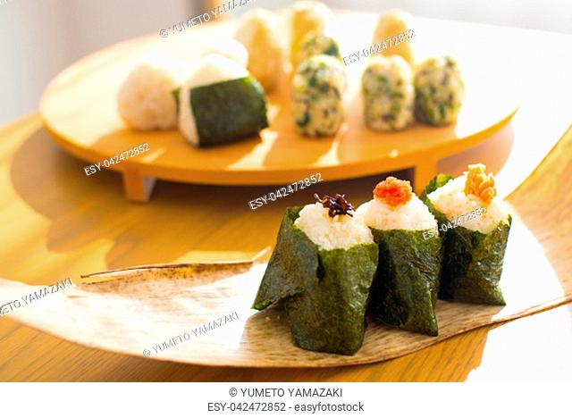 Set of Rice Ball 'Onigiri' is a typical meal in Japan. Japanese people grab some rice into balls with a shape of triangul in Tokyo, Japan