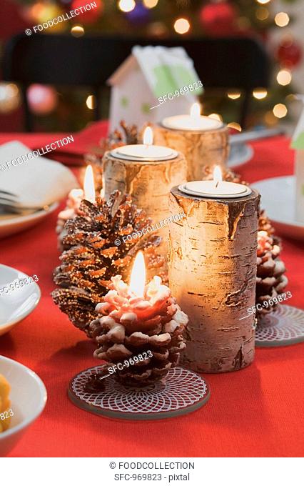 Burning candles on Christmas table
