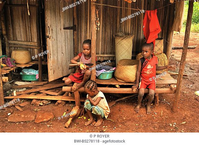 three little children in front of a hut, Madagascar, Nosy Be
