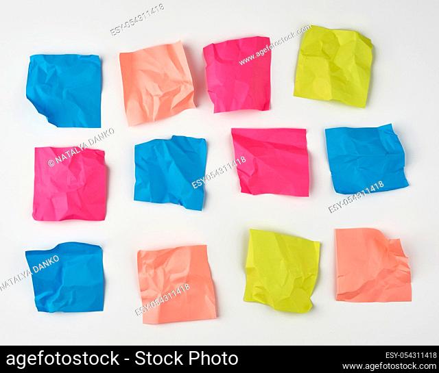 multicolored blank crumpled paper stickers of different sizes on a white background