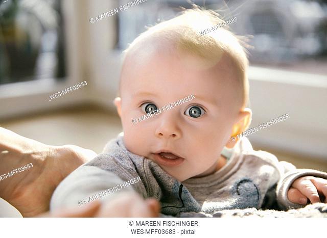 Portrait of amazed baby boy