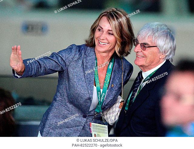 Former Romanian olympic medalist Nadia Comaneci and Formula One boss Bernie Ecclestone arrive prior to the opening ceremony of the Rio 2016 Olympic Games at the...