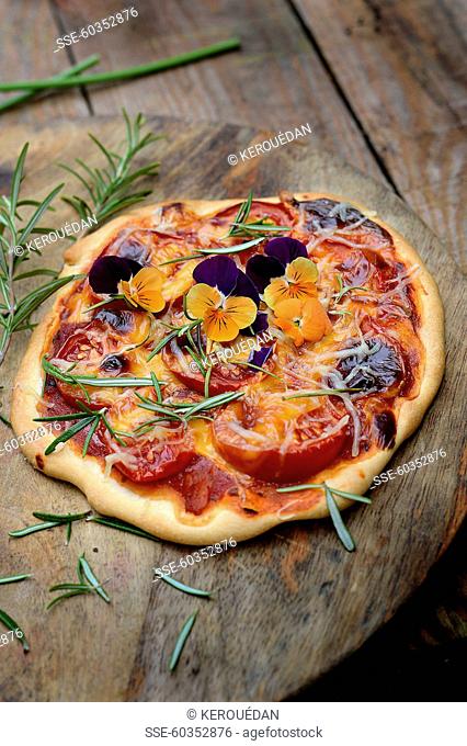 Tomato, cheddar, rosemary and pansy pizza