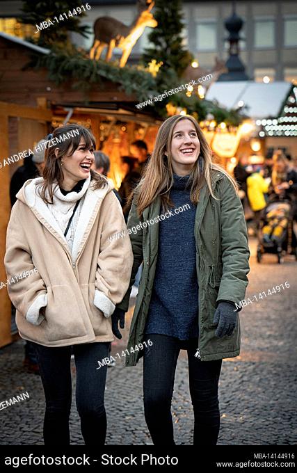 two friends experience the christmas market in bamberg, bavaria, germany