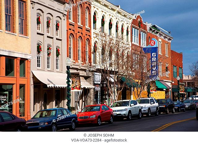Historic Main Street with Red Brick Storefronts, parked cars and Gray's Pharmacy in Franklin, Tennessee, a suburb south of Nashville, Williamson County, Tenn