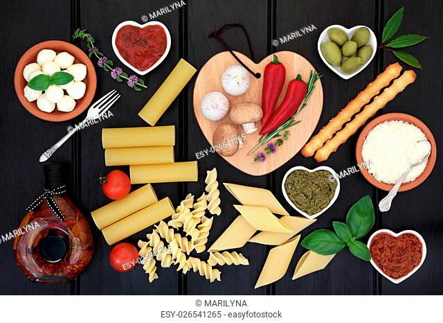 Italian and mediterranean healthy food ingredients over dark wood background