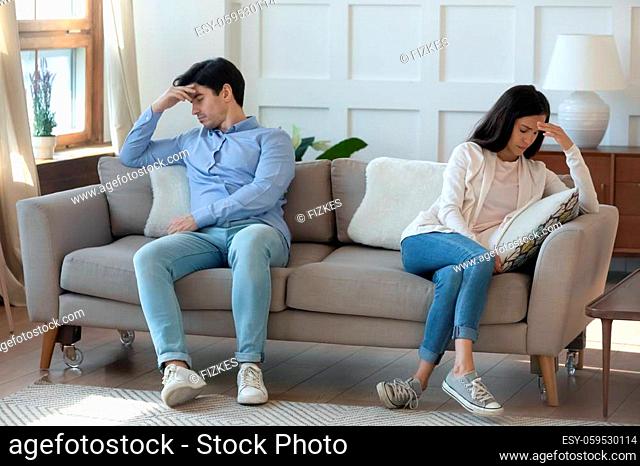 Couple Sitting Apart On Sofa Stock Photos And Images | Agefotostock