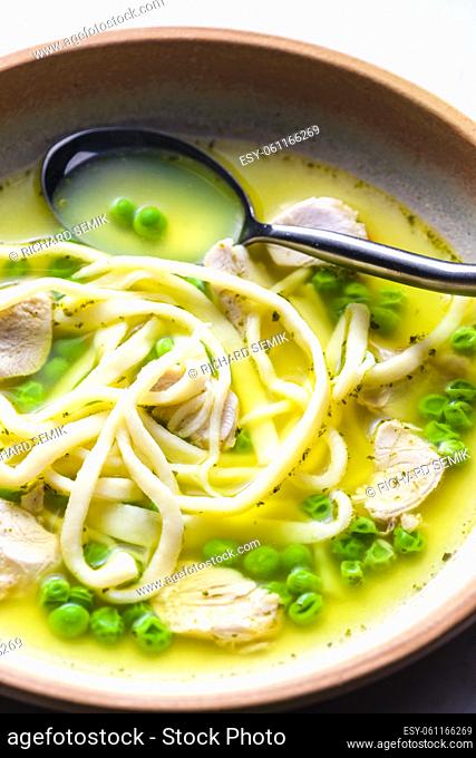 chicken broth with green peas and noodles