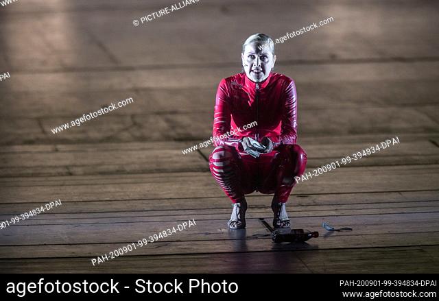 01 September 2020, Hamburg: The singer Valery Tscheplanowa in the role of the actress squats on the stage during the photo rehearsal of ""molto agitato""