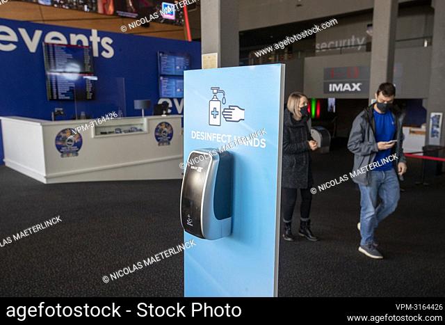 Illustration picture shows a hand-sanitizer dispenser at the entry of a Kinepolis cinema complex in Brussels, Saturday 01 January 2022