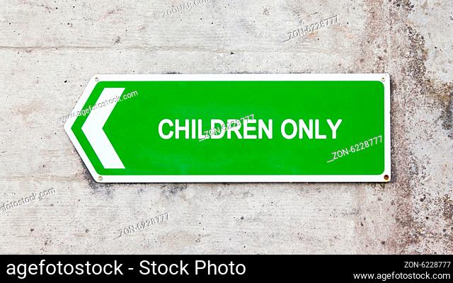 Green sign on a concrete wall - Children only