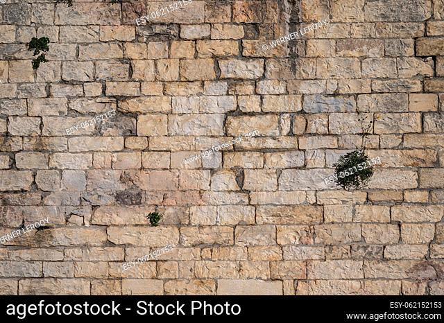 Nimes, Occitanie, France, Textured brick stone wall of an ancient building