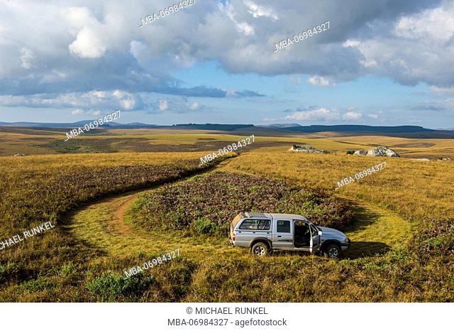 Jeep in the grasslands of the Nyika National Park, Malawi, Africa