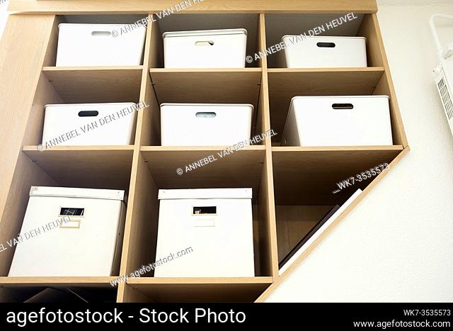 Modern interior white boxes in wooden shelfs for storage, modern interior clean up organized