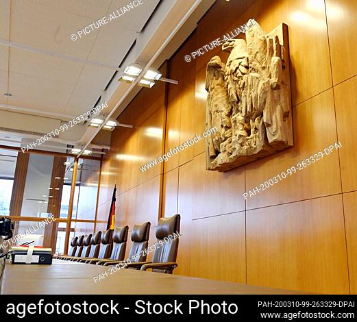 10 March 2020, Baden-Wuerttemberg, Karlsruhe: The empty bench in the session room of the Federal Constitutional Court, taken before the beginning of the oral...