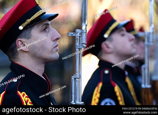 19 December 2023, Georgia, Tiflis: Guards wait in front of the Ministry of the Interior in Tbilisi for the arrival of Federal Minister of the Interior Faeser