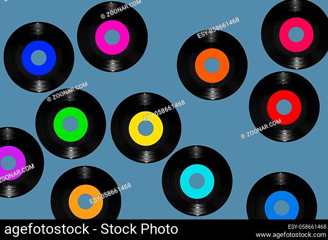 vinyl 45rpm single records on a blue background