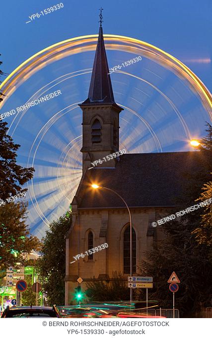 church and Ferris wheel at night, Luxembourg